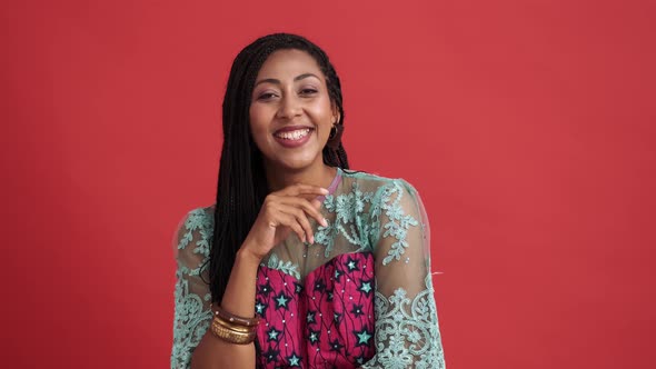 A happy african american woman laughing looking to the camera alt
