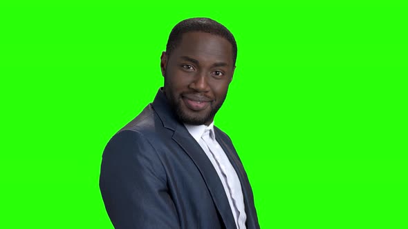 Young Sexy Stylish Businessman on Green Screen. alt