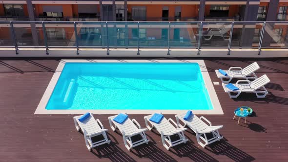 Luxury Pool on the Roof of the House with Sun Loungers and Towels for Tourists to Relax with Clear
