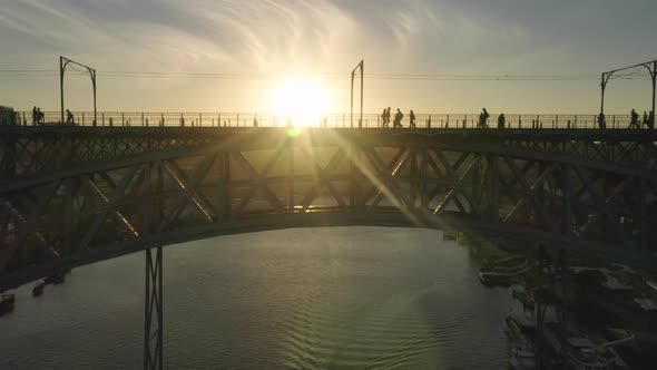Vibrant Transport Artery with Pedestrian and Vehicle Roads Crossing the River alt