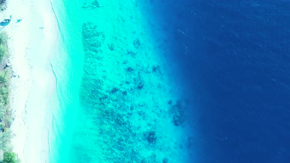 Tropical overhead copy space shot of a sunshine white sandy paradise beach and aqua blue water backg alt