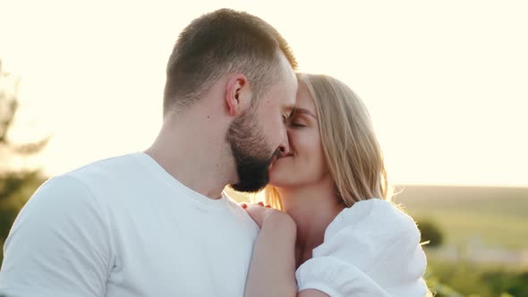 Young Man and Woman in the Sunflower Field alt