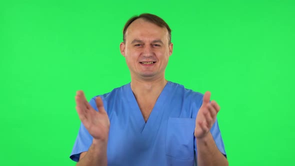 Medical Man Claps His Hands with Joy and Delight. Green Screen alt