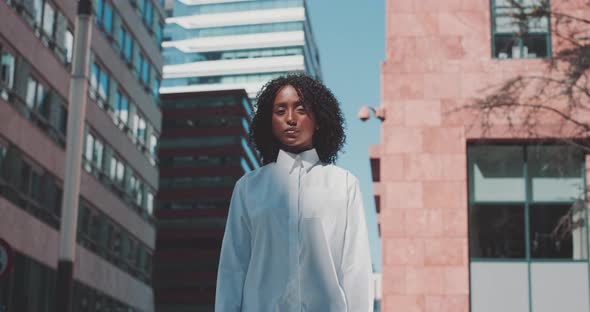 Woman looks forward confidently alt