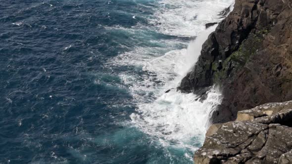 Sea Crashing Against Coastline Cliffs alt