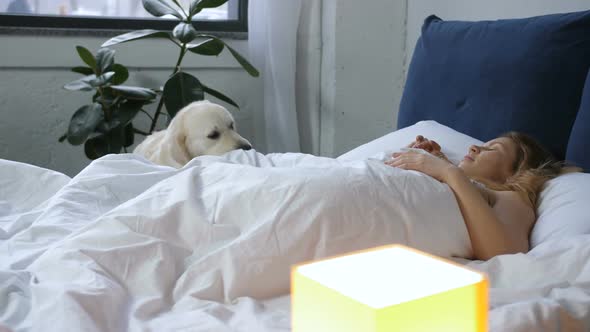 Retriever Waking Up Female Owner in the Morning