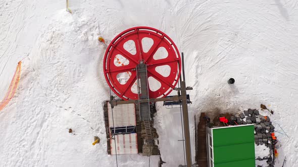 Top down view of the ski lift in winter.Skiers and snowboarders do the same.