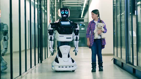 Cyborg and a Teenage Girl are Walking Through the Hall alt