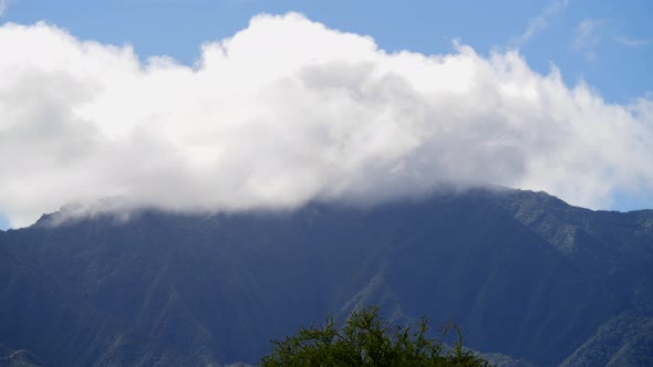 gaiant cloud goes trough a mountain time lapse in hawaii alt