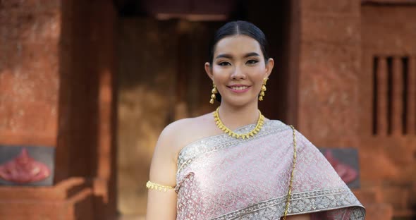 Portrait of Thai woman salute of respect in traditional costume of thailand alt