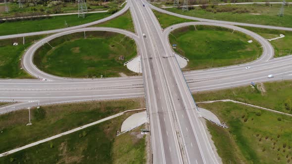 Aerial View of a Suburban Interchange with Few Moving Vehicles alt