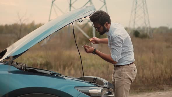 Sad Disappointed On Car Accident.Frustrated Businessman Broken Car Check Open Hood Engine Oil Level. alt