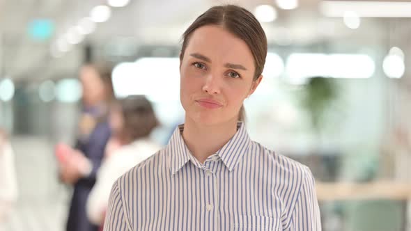 Portrait of Serious Young Woman Saying No By Head Shake alt