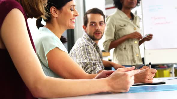Business executives discussing during meeting alt