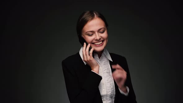 Attractive Brunette Bussines Woman Talking on Phone and Smiling alt
