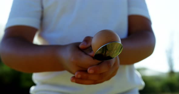 Children playing lemon and spoon race alt