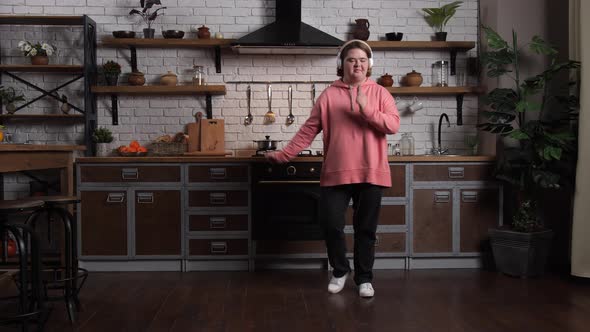 Cute Curvy Girl with Down Syndrome Dancing at Home alt