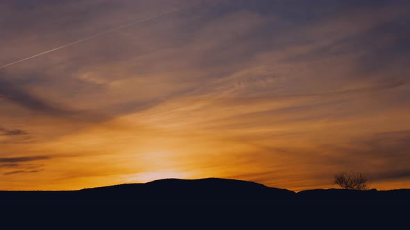 Brilliant Orange and Blue Sunrise Timelapse Zoom in