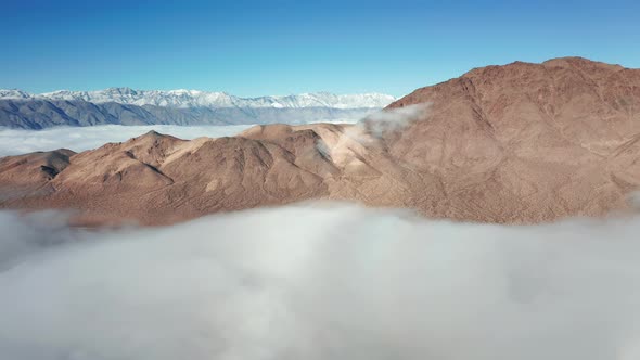 Beautiful Aerial Flying Above the Death Valley Covered By Clouds at Sunrise,  alt