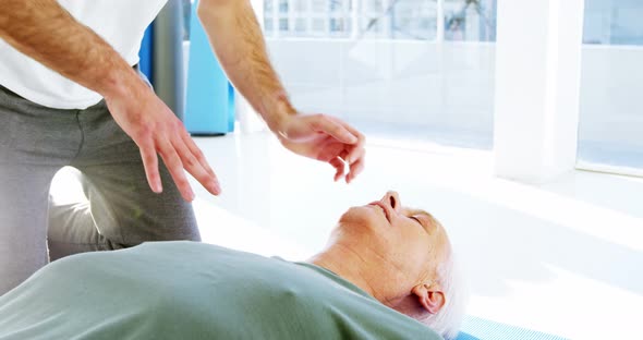 Male paramedic during cardiopulmonary resuscitation alt