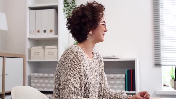 Young Woman Dances in her Home Office alt