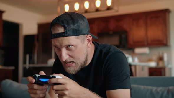 A Determined Male Gamer Who Experiences Emotional Stress When He Plays Video Games alt