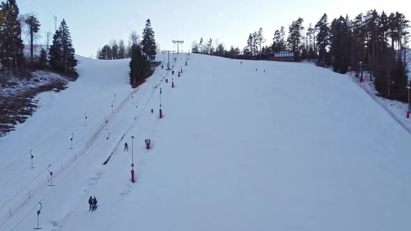 Aerial View of Downhill Skiing at Local Ski Resort. Ski Lift. Russia, Leningrdaskaya Oblast, Village