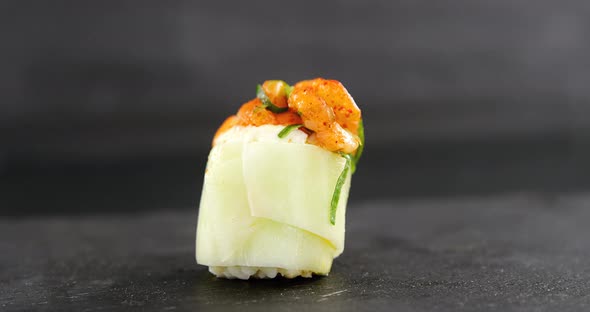 Sushi served on grey stone slate alt