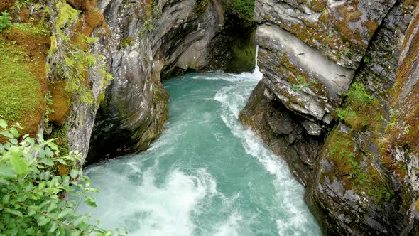Stone Canyon In The Mountains Through Which Flows The Pure Turquoise River alt