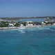Aerial camera flies off coastal area of Cockburn Town, Grand Turk, Turks and Caicos - VideoHive Item for Sale