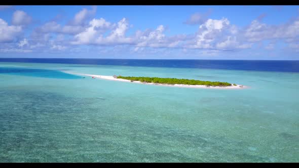 Aerial drone shot scenery of beautiful island beach lifestyle by blue sea and white sandy background alt