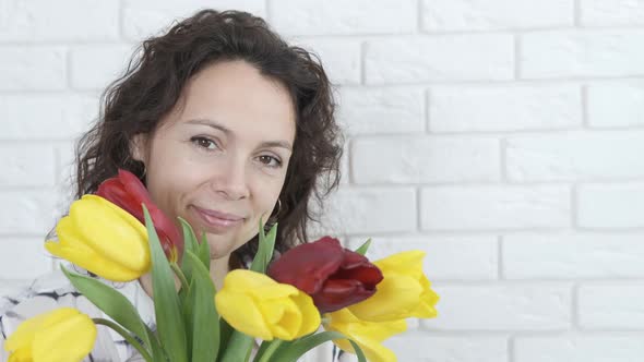 Woman with flowers.  alt