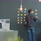 Back View of Businessman Reading Info on Sticky Notes on Wall in Creative Office - VideoHive Item for Sale