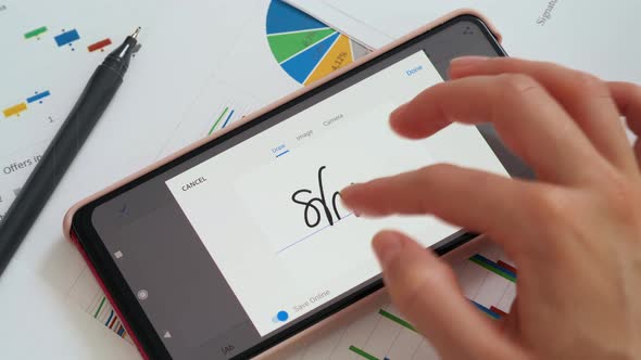 Electronic signature on smartphone screen, e-signing concept alt