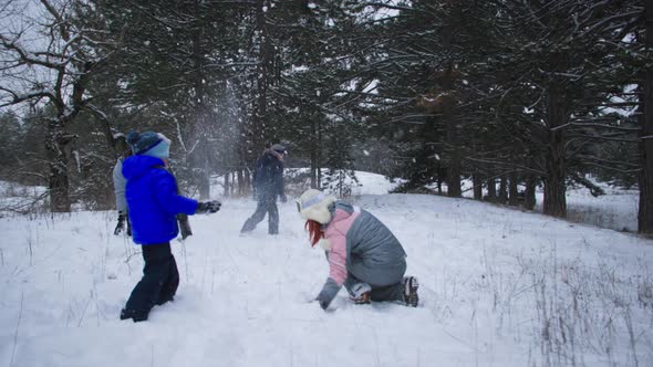 Winter Activities Happy Family Together with Young Children Have Fun Playing Snowballs in Clearing