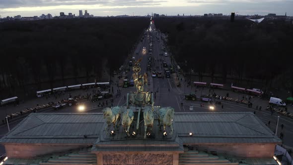 AERIAL: Close Up of Quadriga Green Statue on Brandenburger Tor in Berlin, Germany on Sunset  alt