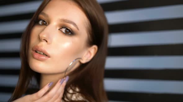 Model Looking at Camera in Studio. Portrait Girl Open Eyes. Female Nature Beauty. Young Woman Open