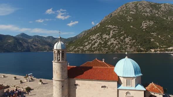 Drone View of the Bell Tower and the Roof of the Church of Our Lady on the Rocks alt