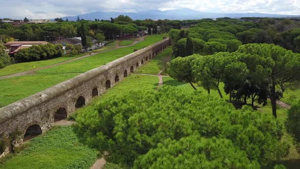 Biker And A Man Walking On The Trail In Parco Degli Acquedotti (Park of the Aqueducts) In Rome Italy alt