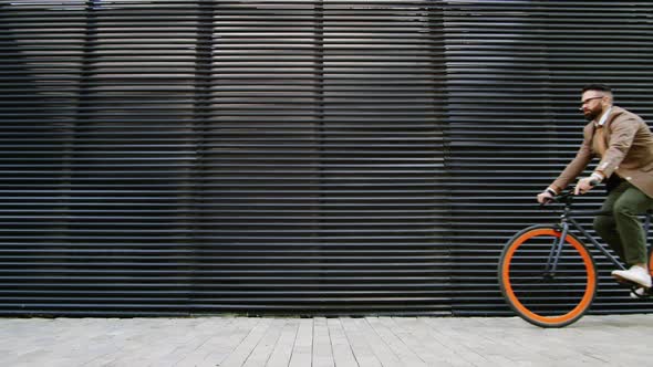 Male Office Worker Riding Bike in the City alt