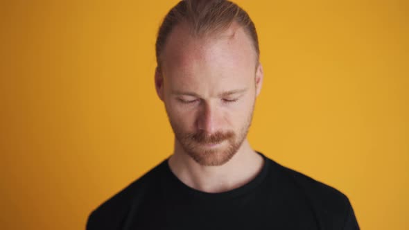 Smiling man looking at the camera alt