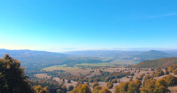 Fly Over Mountains And Hills With Autumnal Vegetations On A Misty Morning. Aerial Drone alt