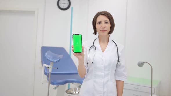 Gynecologist Shows an Smartphone with a Chromakey