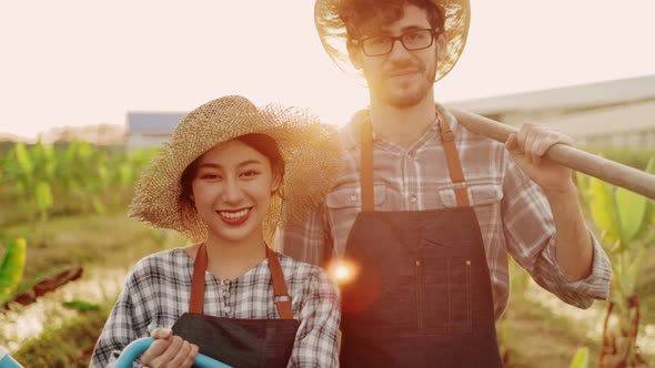 couple farmers owner working in vegetables hydroponic farm alt