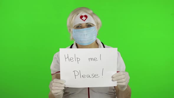 Elderly Female Doctor in Medical Mask Show Page with Message. Coronavirus alt