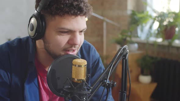 Male Blogger Recording Podcast alt