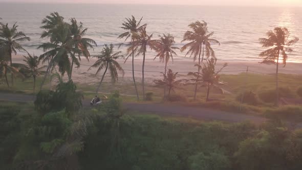A Single Vehicle On The Road Beside The Coastline Of Varkala Beach In The State Of Kerala, India. -a alt