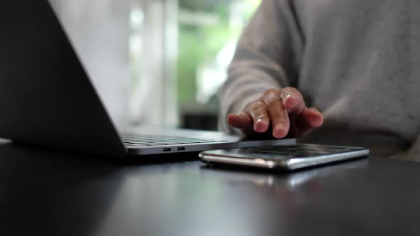 A woman touching and scrolling on smart phone screen