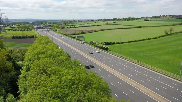 Aerial footage of the motorway in the UK known as the M1 showing traffic on the road in the UK alt