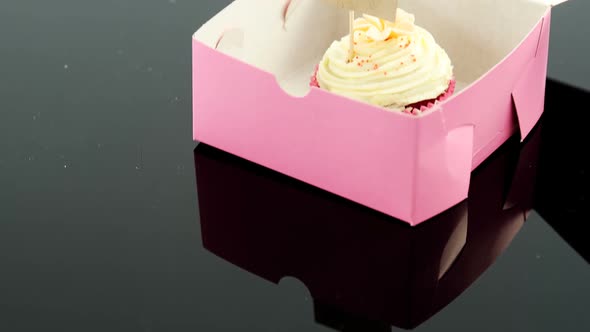 Cupcake with happy mother day card against black background alt